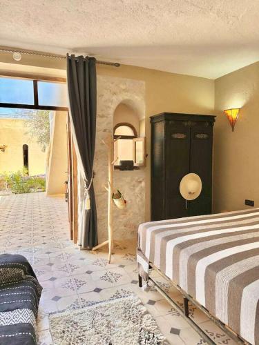 Postel nebo postele na pokoji v ubytování Al jazira Suite by Maj Nia - Jardin - Piscine - Luxe - 2 Px
