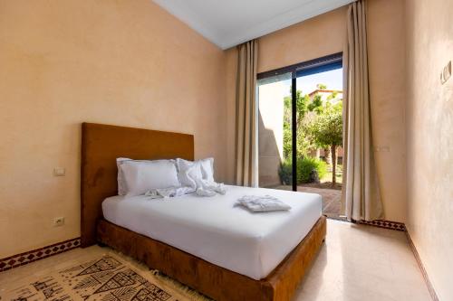 Ένα ή περισσότερα κρεβάτια σε δωμάτιο στο Malaya Majestic