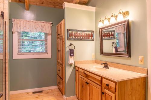 a bathroom with a sink and a mirror at Serenity Now in Fleetwood