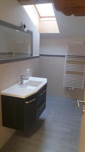 a bathroom with a sink and a mirror at Nagelehof 3 in Ainet