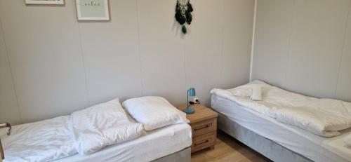 Postel nebo postele na pokoji v ubytování Biały Fortepian