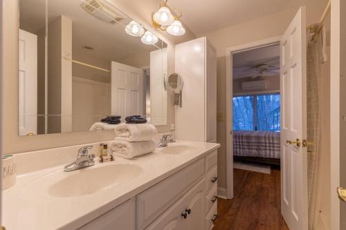 a bathroom with a sink and a mirror at Blue Ridge Vista in Banner Elk