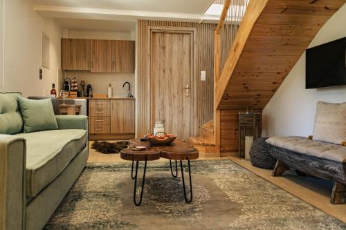 a living room with a couch and a table at Mont Rock in Synikia Mesi Trikalon
