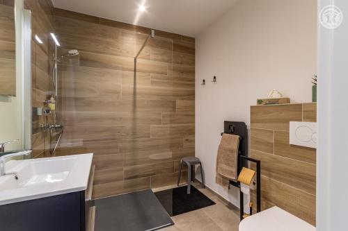 a bathroom with a sink and a shower at Coeur de fournache in Saint-Jean-de-Maurienne