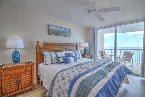a bedroom with a bed with a view of the ocean at Crescent Shores North - 1502 in Myrtle Beach