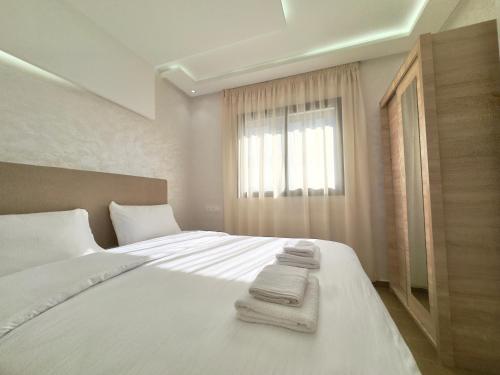 Postel nebo postele na pokoji v ubytování Dar Najat - 5 min Grand Stade - 10 min Aéroport