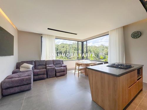 Гостиная зона в Apartamento de lujo a 3 minutos del Aeropuerto JMC 302