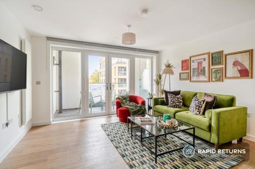 a living room with two couches and a tv at BRAND NEW! Modern & Spacious Serviced Apartments With FREE Parking & Gym by Rapid Returns - Professional Host in Walton-on-Thames
