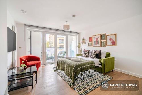 a living room with a bed and a couch at BRAND NEW! Modern & Spacious Serviced Apartments With FREE Parking & Gym by Rapid Returns - Professional Host in Walton-on-Thames