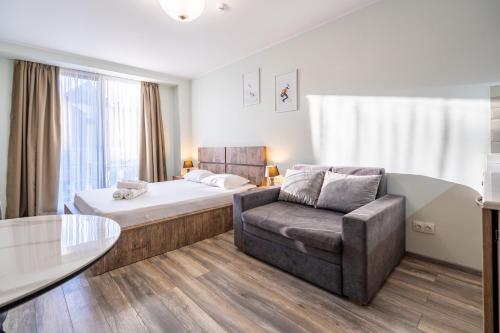 Giường trong phòng chung tại New Gudauri, Loft 1 Apartment