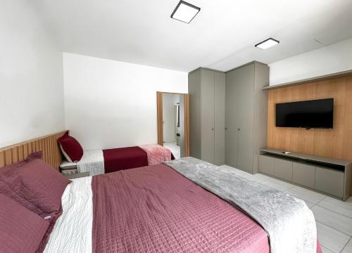 Ein Bett oder Betten in einem Zimmer der Unterkunft Casa de Praia - Brisa do Mar