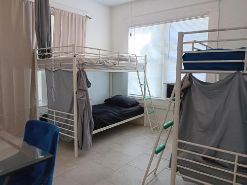 Ένα ή περισσότερα κρεβάτια σε δωμάτιο στο Hostel Tampa, near downtown, Ybor City, 15 minutes drive to airport