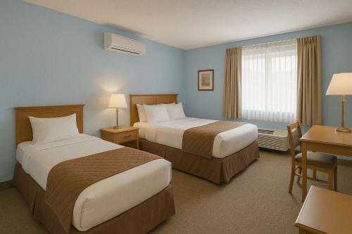 Ένα ή περισσότερα κρεβάτια σε δωμάτιο στο Sunset Grove Hotel