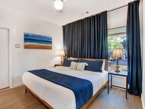 a bedroom with a large bed and a window at Lime Time in Tybee Island