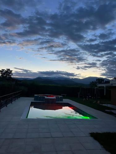 a swimming pool with a view of the mountains at Colombia Escape - Cafe Acapulco Extasis in Viterbo