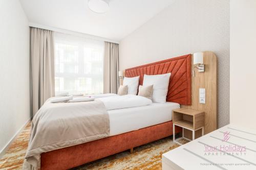 Кровать или кровати в номере Your Holidays Bel Mare Aqua F234