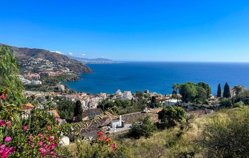 a view of a city and the ocean from a hill at Lovely Home In Almuñecar With Ethernet Internet in Almuñécar