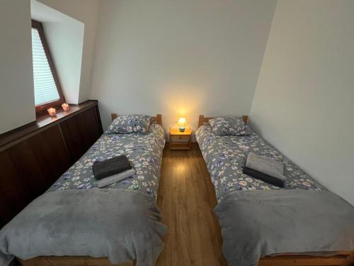 En eller flere senge i et værelse på NAD GALERIĄ