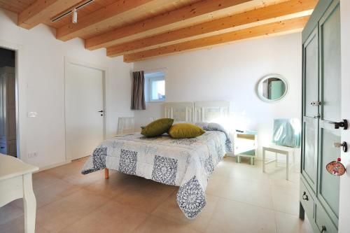 Postel nebo postele na pokoji v ubytování Agriturismo Corte Bonetti