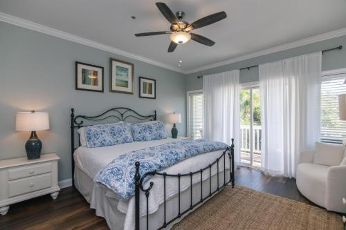 a bedroom with a bed and a ceiling fan at Retreat 7B - Jubilee in Edisto Island