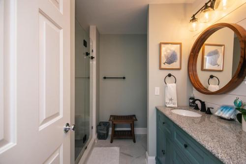 a bathroom with a sink and a mirror at Retreat 7B - Jubilee in Edisto Island