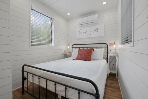 a bedroom with a bed with a sign for our yard at Hiltop Haven The Top Deck in Rockbridge