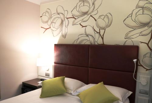 Cama o camas de una habitación en Hotel Villa Nabila