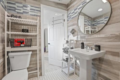 a bathroom with a toilet and a sink and a mirror at The Shack in Buckeye Lake
