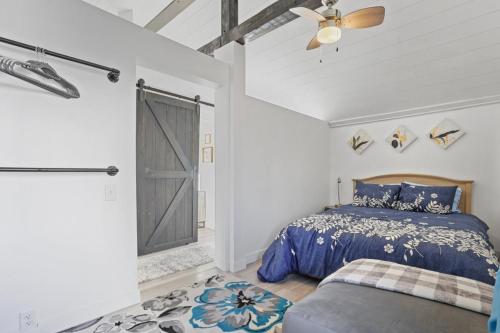 a bedroom with a bed and a ceiling fan at The Shack in Buckeye Lake