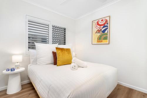 Ένα ή περισσότερα κρεβάτια σε δωμάτιο στο Tugun Beachfront Retreat