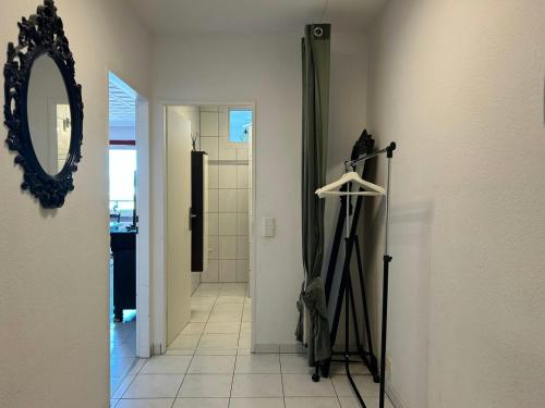 a hallway with a mirror and a walk in closet at Central Studio for 2 in Hattersheim