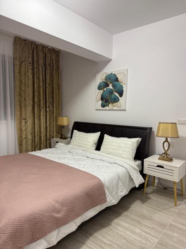 Una cama o camas en una habitación de Rossi Apartment