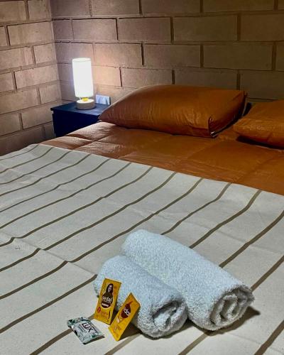 En eller flere senge i et værelse på Hostería Kakan Y Excursiones