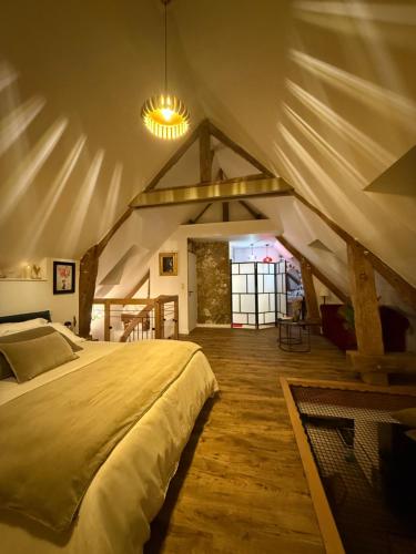 Postel nebo postele na pokoji v ubytování Ecrin de Charme