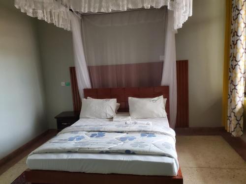 Postel nebo postele na pokoji v ubytování Yvg home of kindness