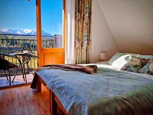 Postel nebo postele na pokoji v ubytování Pokoje u Hanki