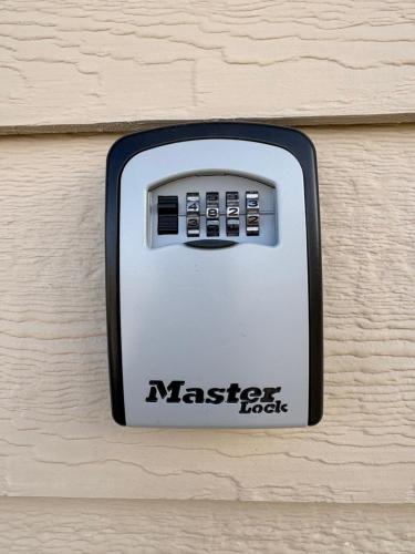 a metal lock on the side of a wall at Cozy Cottage in the Tetons in Driggs