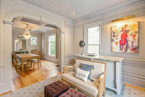 a living room with a couch and a table at Guestroom in Old Town | Steps to Lake & Everything in Niagara on the Lake