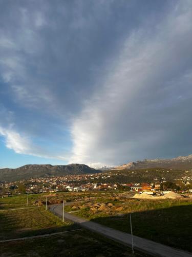 a view of a city with mountains in the background at Great Deal in Podgorica