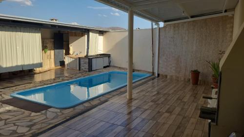 Bazén v ubytování Casa de Temporada Piumhi nebo v jeho okolí