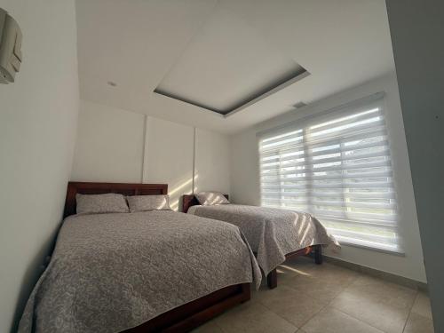 Ένα ή περισσότερα κρεβάτια σε δωμάτιο στο Amai Lodge