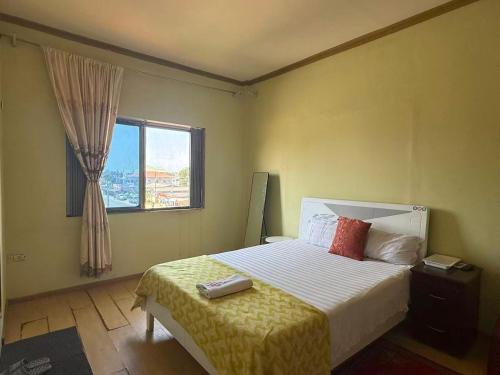 Postel nebo postele na pokoji v ubytování Huayun Primier Hotel