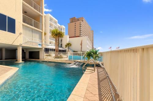 a swimming pool in the middle of a building at Beachfront Bliss! 1800 sq ft Spacious 3BR Sleeps 12 - Oceans 9D in Gulf Shores