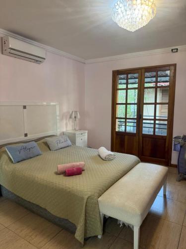 a bedroom with a large bed with two pillows on it at La Bendita in Posadas