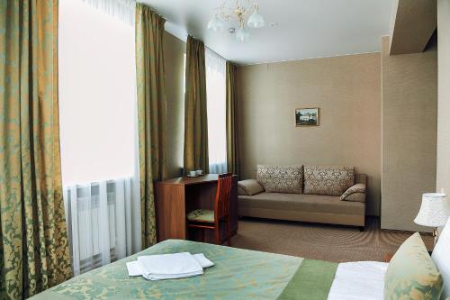 Кровать или кровати в номере Отель Губерния