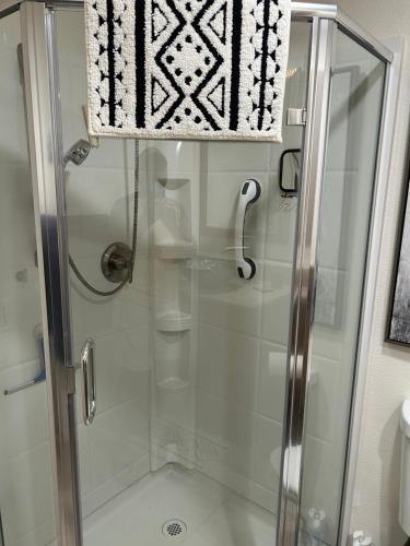 a shower with a glass door in a bathroom at Rancho Mirage Gem! 90 day-bookings only in Rancho Mirage