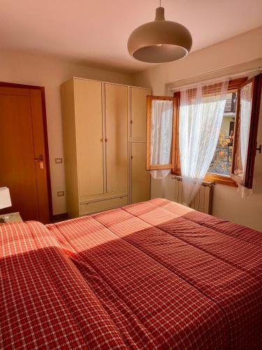 Postel nebo postele na pokoji v ubytování Maiella Experience - Bilocale in centro e piste sci