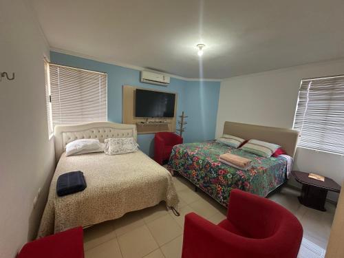 Ένα ή περισσότερα κρεβάτια σε δωμάτιο στο Recanto Luna Foz