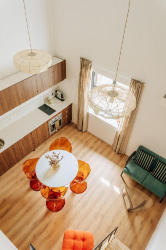 a living room with a table and chairs at Appartement centre village Tavel in Tavel