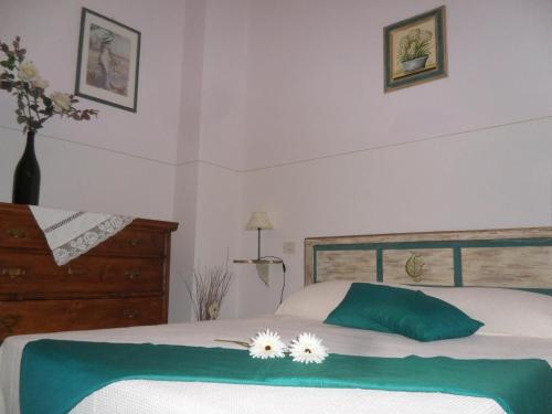 Postel nebo postele na pokoji v ubytování Ferienwohnung Rose In Cagli